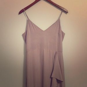 Floor length mauve dress.
